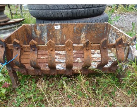 A cast iron fire grate, 23" x 15" x 10" high.