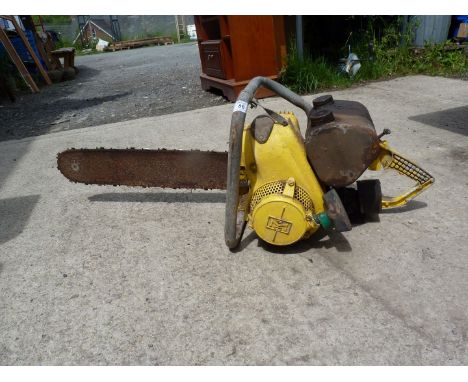 An old/vintage chainsaw. [Engine had good compression at the time of lotting].