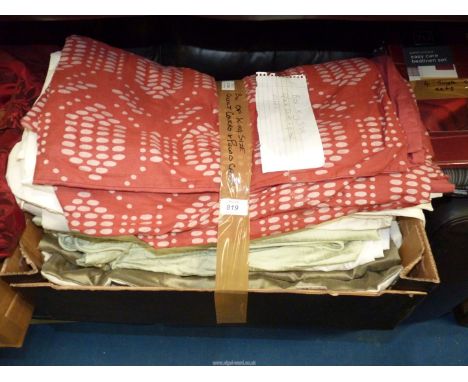A box of King size quilt covers and pillow cases.