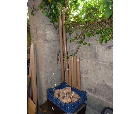 A quantity of curtain poles, with rings and wall fixings.