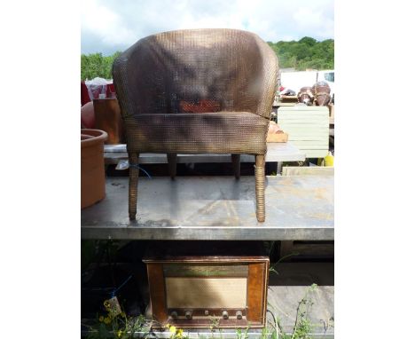 A Lloyd loom style chair and an old Philips wireless.