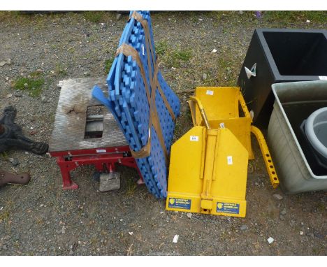 A wheel clamp, foam interlocking matting and a motorcycle lift.