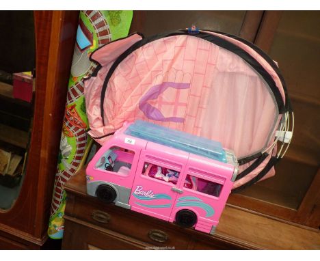 A Barbie Dreamcamper, a play tent and a Thomas & Friends railway play mat.