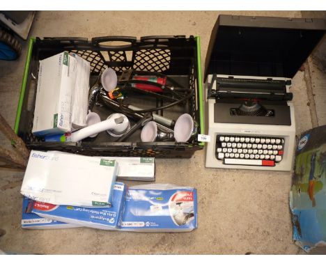 A box of miscellaneous, foot pump, typewriter, surgical gloves etc.