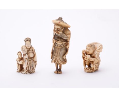 Y Tomochika: An Ivory Netsuke, in the form of the goddess Benten standing holding an uchiwa in one hand with an attendant bes