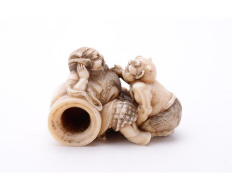 Y Munenori: An Ivory Netsuke carved as Shoki, the Demon Queller resting against a large overturned sake jar as an Oni creeps 