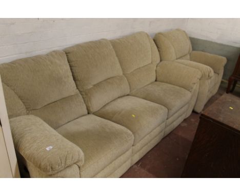 A MODERN UPHOLSTERED TWO PIECE SUITE CONSISTING OF A TWO SEATER SOFA AND AN ARMCHAIR