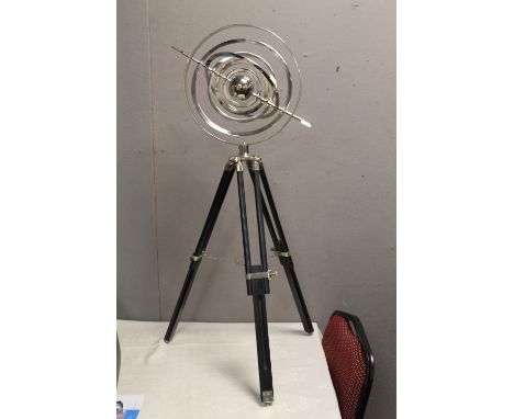 A FLOOR STANDING CHROME ARMILLARY SPHERE ON TRIPOD