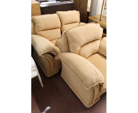 AN UPHOLSTERED TWO PIECE SUITE CONSISTING OF A TWO SEATER SOFA AND AN ARMCHAIR