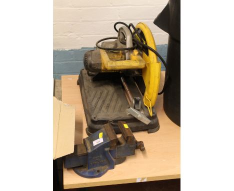 A DEWALT TABLE SAW TOGETHER WITH A BENCH VICE