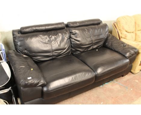 A BLACK FAUX LEATHER TWO SEATER SOFA