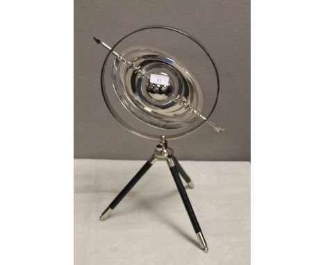 A TABLE TOP CHROME ARMILLARY SPHERE ON TRIPOD