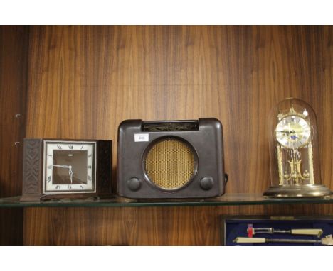 A VINTAGE BUSH RADIO TOGETHER WITH A RETRO METAMEC MANTEL CLOCK AND A HERMLE ANNIVERSARY CLOCK