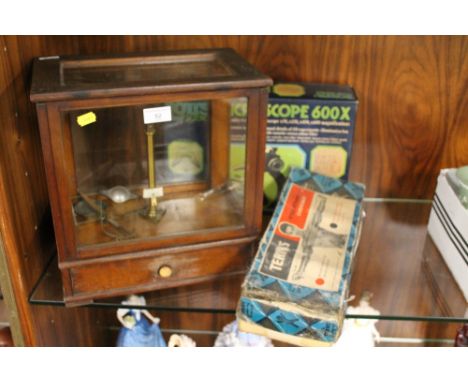 A CASED SET OF SCALES TOGETHER WITH A BOXED 'TERRY'S STEEL STRAND EXERCISER' AND A CHILD'S MICROSCOPE