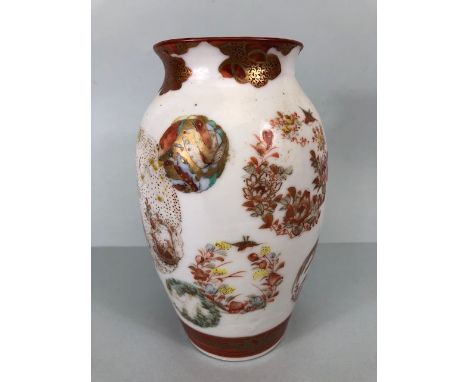 Antique Japanese satsuma vase decorated with roundels of flowers and geometric designs and a central panel depicting a woman 