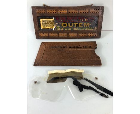 Advertising interest , early 20th century cribbage board with glass advertising panel for OUTEM  corn cure  and a packet cont