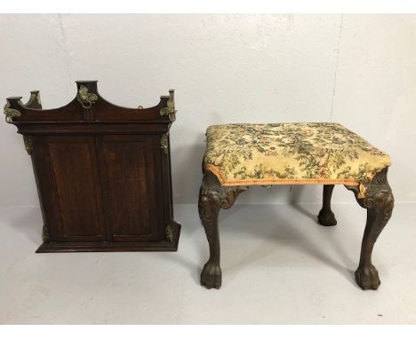 Vintage furniture, a small dark oak wall cupboard with added metal mounts and a foot stool with faux tapestry top 