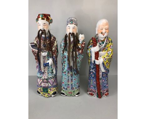 Antique Chinese ceramics, being a trio of large 19th century  Famille Rose Immortals, Luk Sau Fuk.   Luk carrying a sceptre a