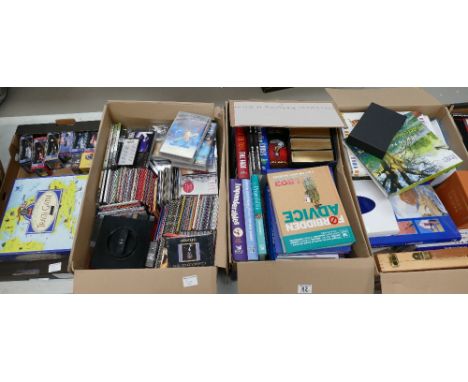 A large collection of items to include easy listening cd's, hard back books, boxed scale model figures, games, etc. (4 Trays)
