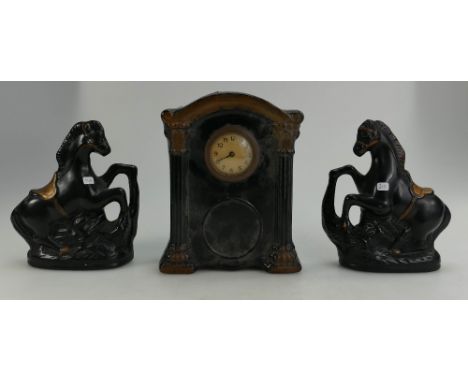 Edwardian ceramic mantle set comprising a clock and two stylised rearing horses.