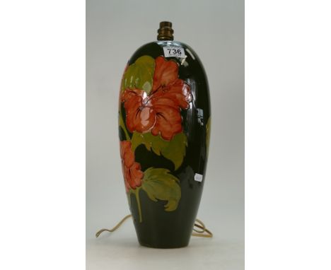 Moorcroft Hibiscus lamp base on green background height 42cm