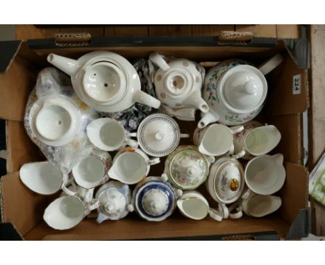 A mixed collection of ceramic items to include floral decorated tea pots, cream and sugar bowls, from Minton, Royal Doulton, 