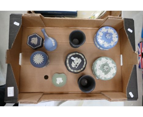 A collection of multi coloured Wedgwood items to include black on cream trinket box, vases, Royal blue trinket boxes, sage gr