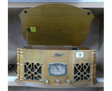 Modern Oak cased record player with in built radio