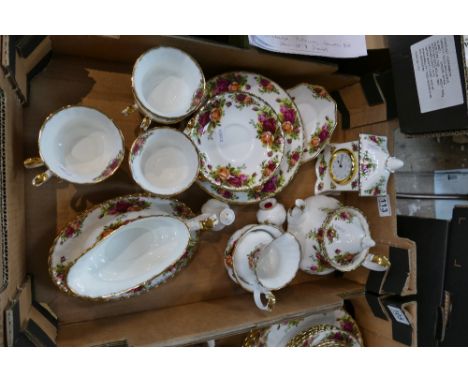 Royal Albert Old Country Roses tea set together with matching gravy boat and mantle clock.