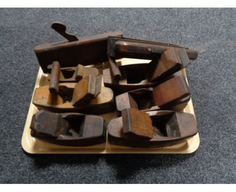 A tray of vintage wood working planes