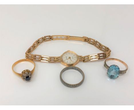 A lady's 9ct gold Accurist wristwatch on 9ct gold bracelet, two 9ct and silver rings and an 18ct gold cluster ring (4) CONDIT