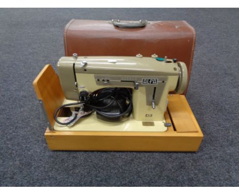 A cased Alfa electric sewing machine  CONDITION REPORT: This item has not been tested.