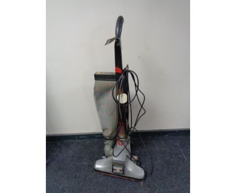 A vintage Kirby upright vacuum 