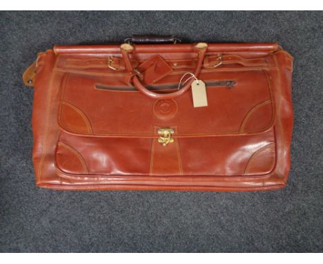 A vintage leather Henry valise together with three other leather cases and bags 