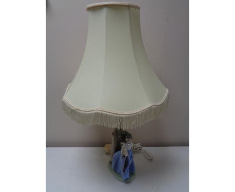 A Nao figural table lamp with shade - Girl with bird in hand 