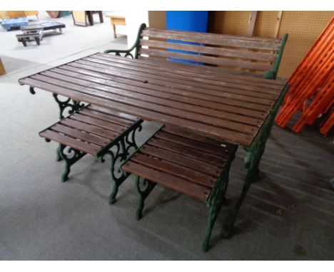 A cast iron wooden garden bench and two stools 