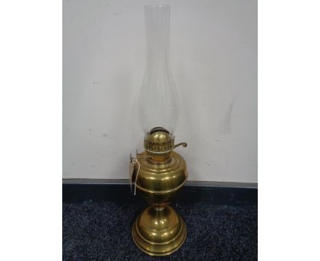 A vintage brass Duplex oil lamp with glass chimney 