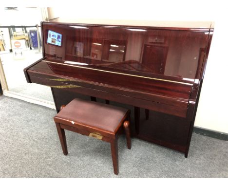 A Kawai overstrung upright piano model K-15E no. F063840, gloss mahogany, together with adjustable stool.