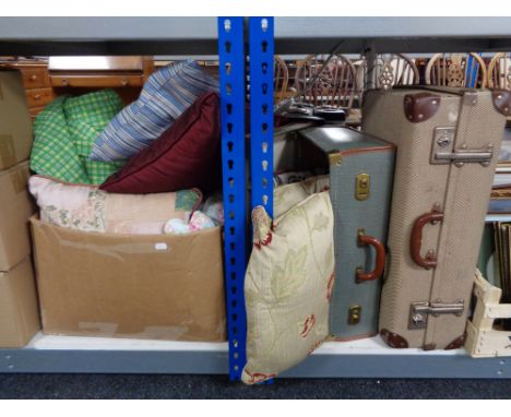 Two vintage luggage cases and a box of assorted cushions and blanket 