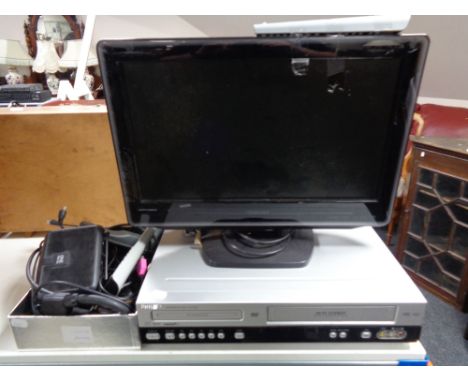 A Philips dvd vcr recorder together with a Toshiba 19 inch lcd tv dvd combi, set top box with leads and remote 