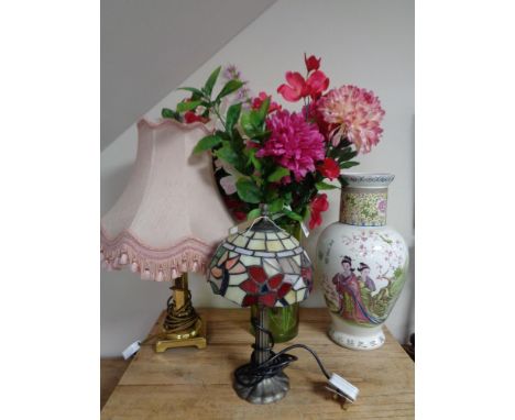 A brass table lamp with shade together with a Tiffany style table lamp, Japanese vase and green glass vase of flowers 