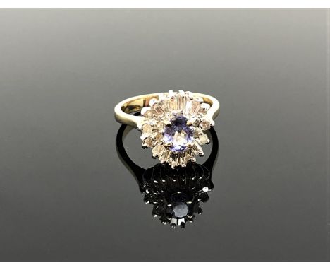 A 14ct gold tanzanite and diamond ring, size M