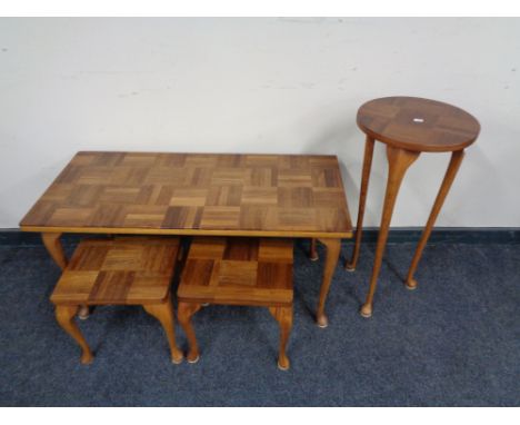 A mid century teak coffee table together with pair of lamp tables and plant stand 