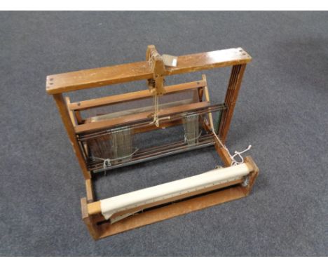 A table topped vintage weaving machine 