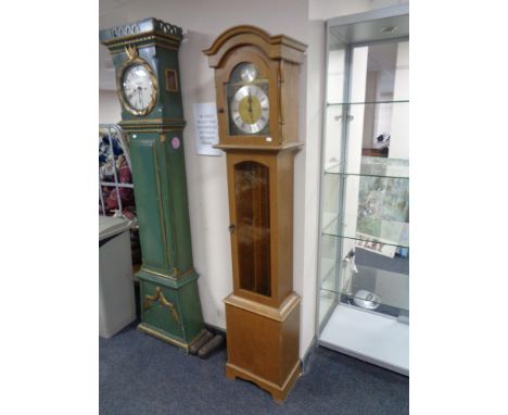 An oak cased Tempus Fugit longcase clock with pendulum and weights 