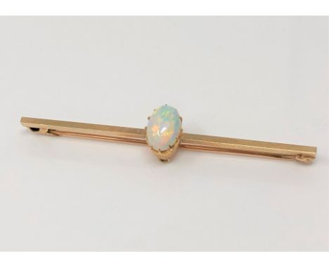 A yellow gold opal bar brooch