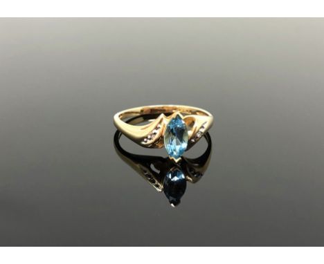 A 10ct gold topaz and diamond ring, size N/O