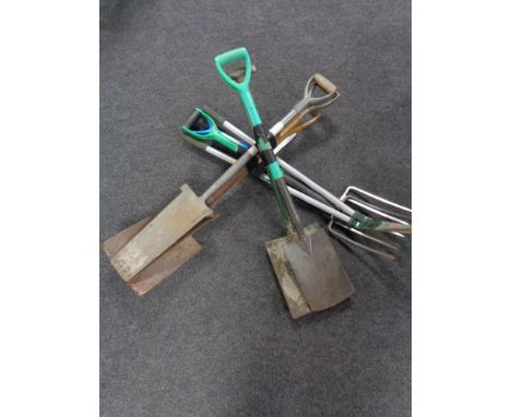 Three bundles of garden tools 