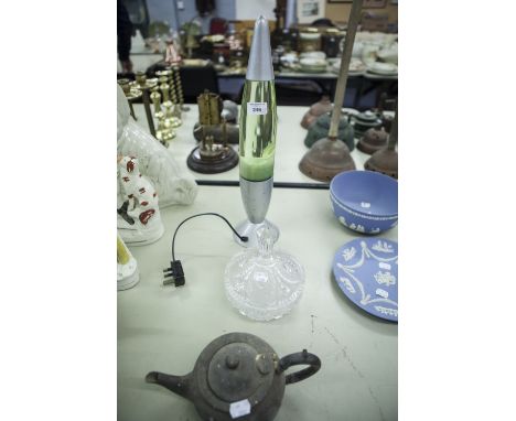 A LAVA LAMP, TORPEDO SHAPED; VICTORIAN BRITANNIA METAL TEAPOT; AND A MOULDED GLASS LARGE TRINKET BOWL AND DOMED COVER (3) 