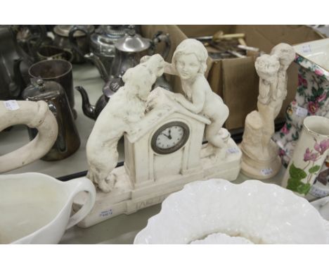 WHITE COMPOSITION FIGURAL MANTEL CLOCK, IN THE FORM OF A NUDE CHILD LEANING ACROSS A KENNEL TO GIVE A LARGE DOG A BONE, THE O